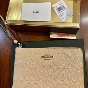 Coach Cream Embossed Wristlet